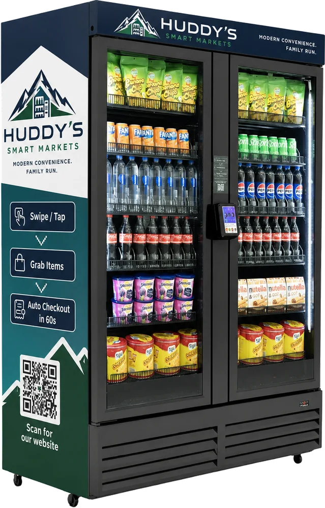 A two-door Huddy's Smart Markets refrigerated market, fully stocked with drinks and snacks.