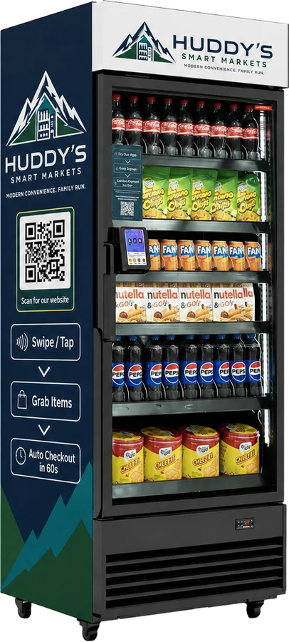 A Huddy's Smart Markets refrigerated market, branded and stocked, with swipe-to-open grab-and-go instructions on the side panel.